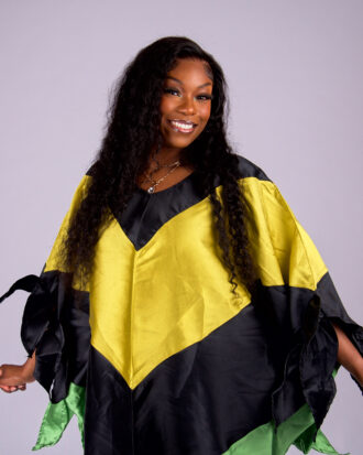 Model wearing The Kaleidoscope color-block boubou in black, yellow, green and orange
