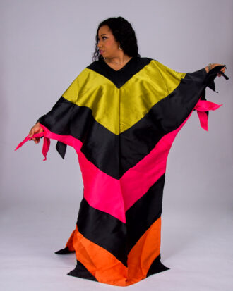 Model wearing The Kaleidoscope color-block boubou in black, yellow, pink and orange