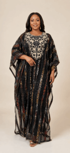 Light-skinned model wearing the Midnight Ankara Illusion Two-Piece Kaftan with front embroidery and Ankara strips on tulle net