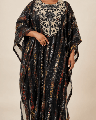 Light-skinned model wearing the Midnight Ankara Illusion Two-Piece Kaftan with front embroidery and Ankara strips on tulle net