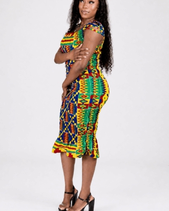 Model wearing the Vibrant Heritage African print smocked midi dress