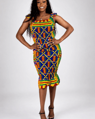 Model wearing the Vibrant Heritage African print smocked midi dress