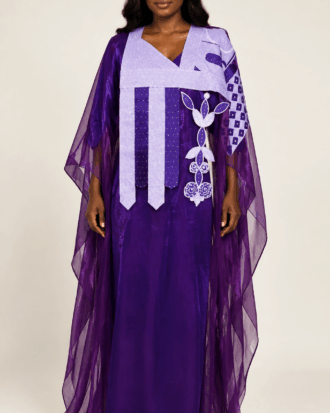 Female model wearing a purple embroidered two-piece boubou