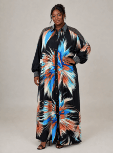 Chocolate-skinned model wearing the Celestial Burst Swarovski Shirt Dress with crystal-embellished shoulders, collar, and cuffs
